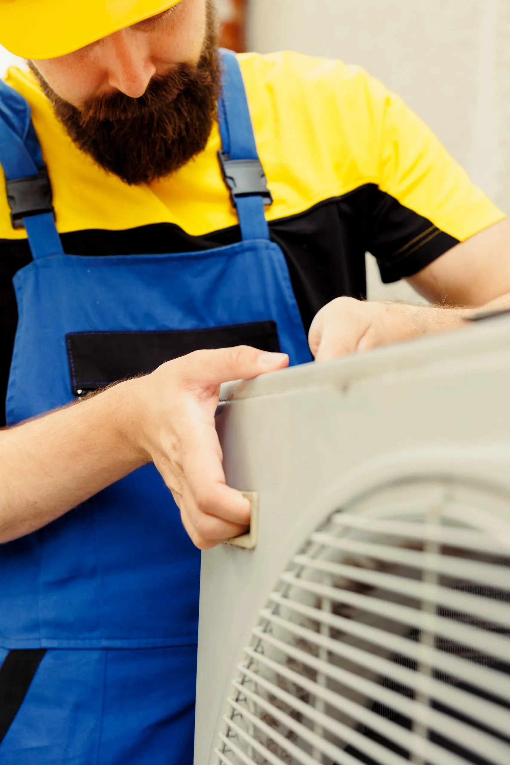Repairman installing capacitor close-up